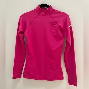 Nike bright pink long sleeve dri-fit top with thumb holes. New without tags.
